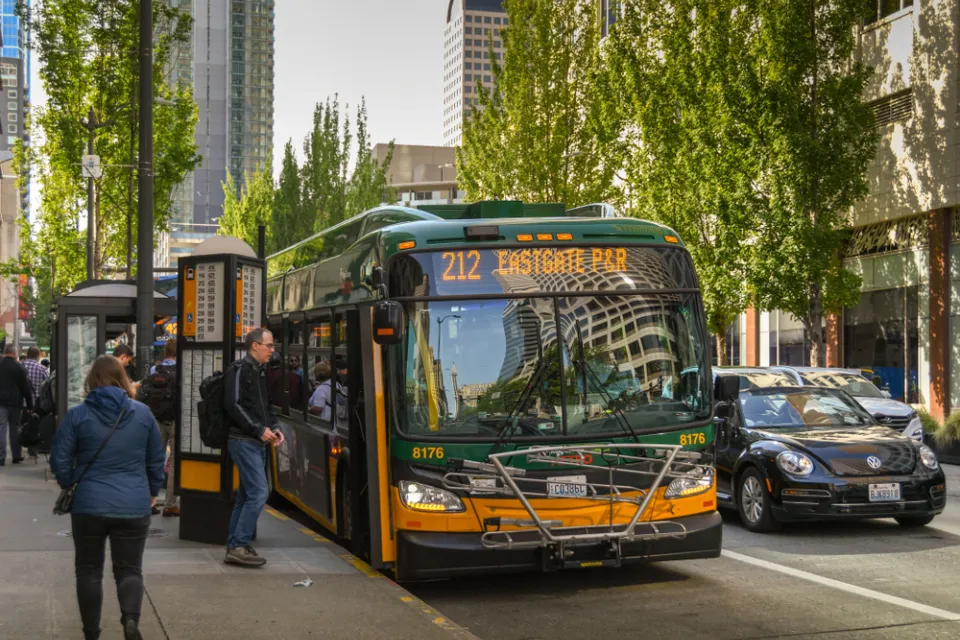 Bus stop with passengers and bus in downtown Seattle